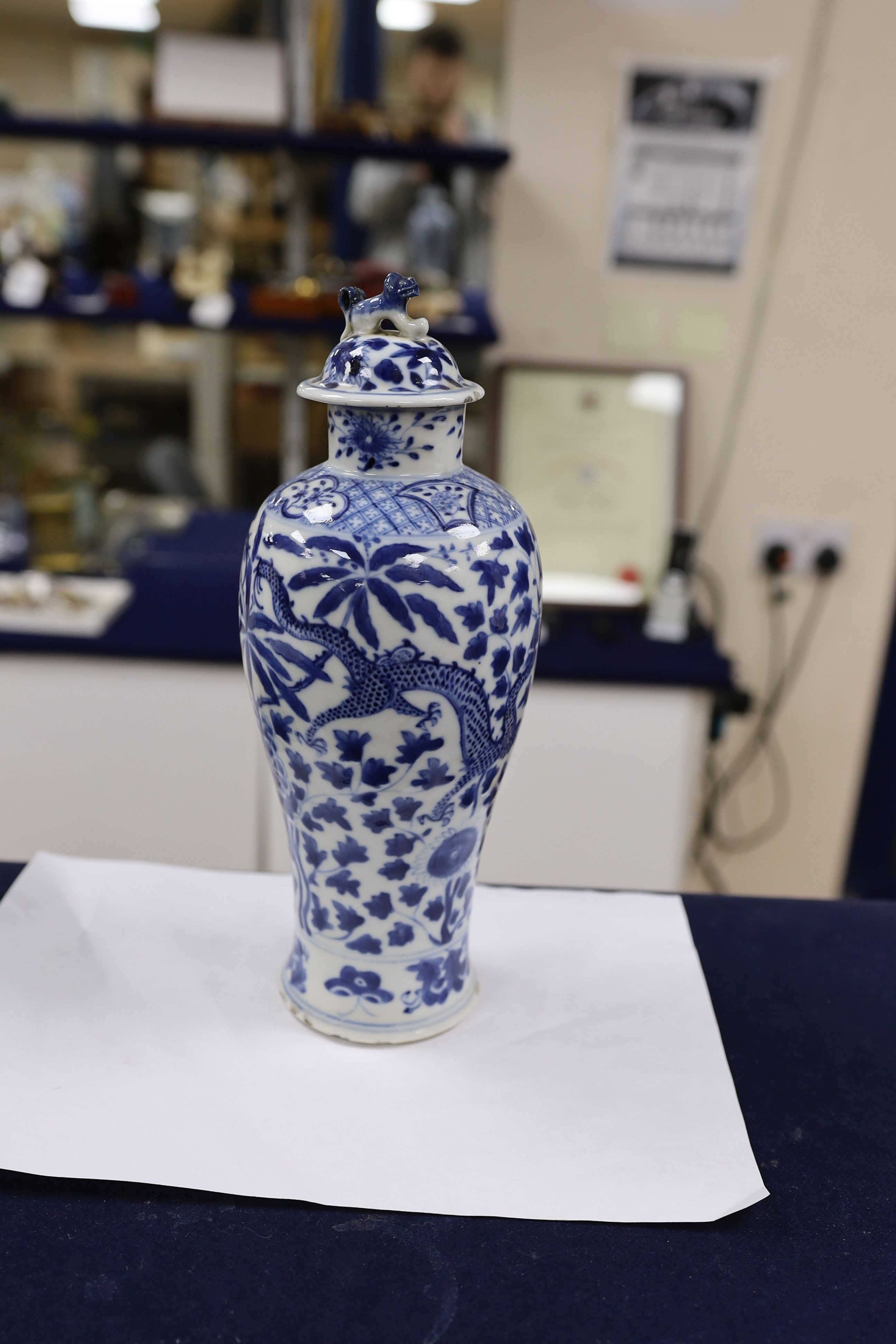 A pair of Chinese blue and white dragon vases and covers, circa 1900. 28cm